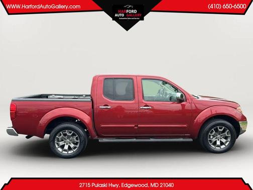 Red 2014 Nissan Frontier SL