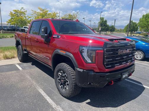 Volcanic Red Tintcoat 2025 GMC Sierra 2500 AT4X