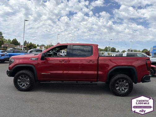 Volcanic Red Tintcoat 2026 GMC Sierra 1500 AT4X
