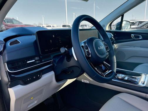 Ivory Silver 2026 Kia Carnival Hybrid SX Prestige