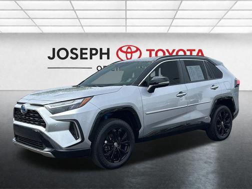 Silver Sky Metallic/Midnight Black Metallic 2023 Toyota RAV4 Hybrid SE