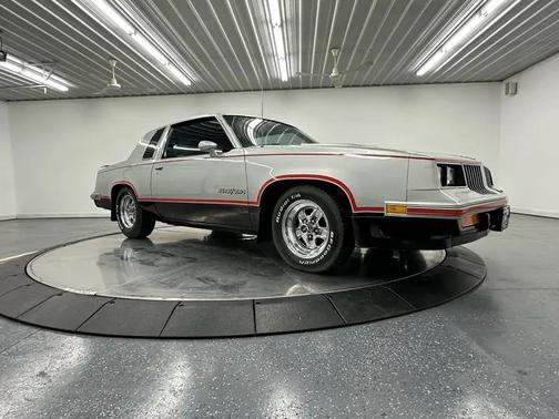 Silver 1984 Oldsmobile Cutlass Calais OLDS 15th Anniversary
