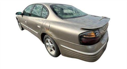 Tan 2001 Pontiac Bonneville SE