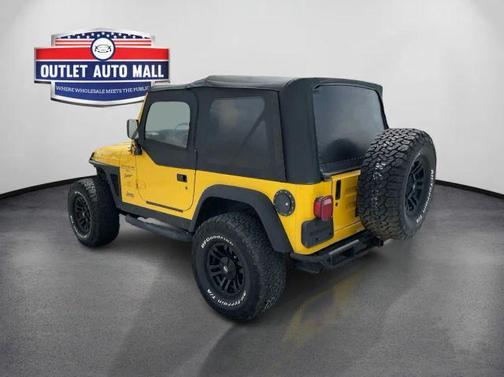 Yellow 2000 Jeep Wrangler Sport