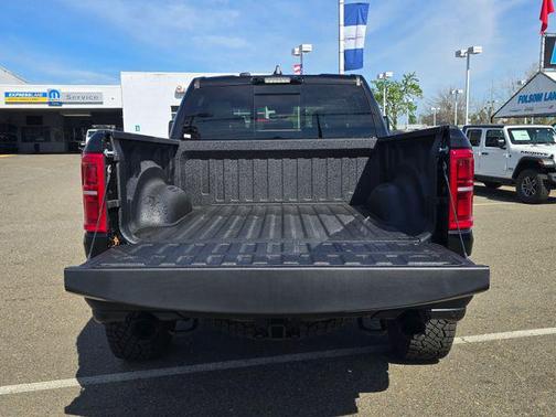 Diamond Black Crystal Pearlcoat 2026 RAM 1500 RHO Crew Cab 4x4 5'7' Box