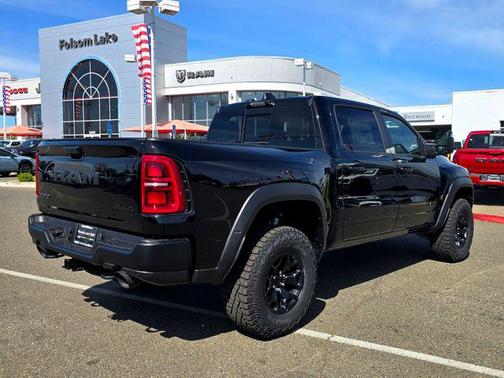 Diamond Black Crystal Pearlcoat 2026 RAM 1500 RHO Crew Cab 4x4 5'7' Box