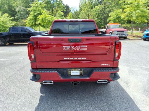 Volcanic Red Tintcoat 2025 GMC Sierra 1500 AT4
