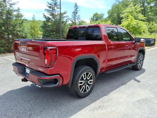 Volcanic Red Tintcoat 2025 GMC Sierra 1500 AT4