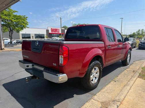 Red 2010 Nissan Frontier SE