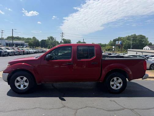Red 2010 Nissan Frontier SE