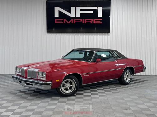 Red 1976 Oldsmobile Cutlass Supreme