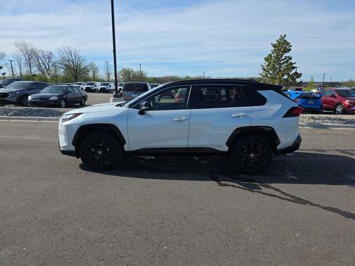 Wind Chill Pearl/Midnight Black Metallic 2023 Toyota RAV4 Hybrid SE