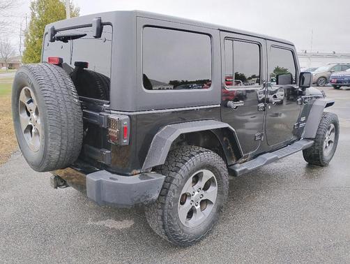 Black 2016 Jeep Wrangler Unlimited Sahara