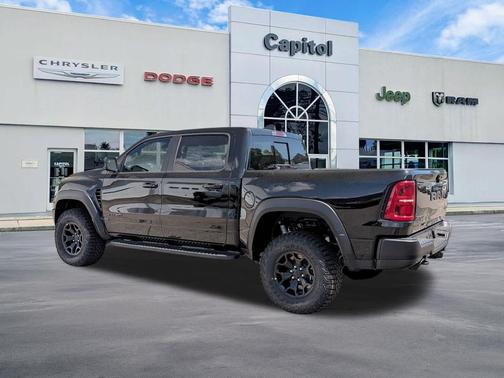 Diamond Black Crystal Pearlcoat 2026 RAM 1500 RHO Crew Cab 4x4 5'7' Box