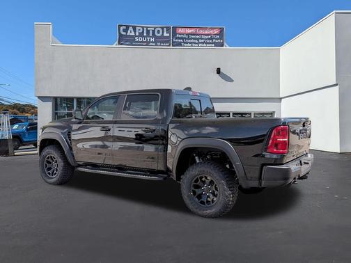 Diamond Black Crystal Pearlcoat 2026 RAM 1500 RHO Crew Cab 4x4 5'7' Box