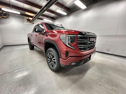 Volcanic Red Tintcoat 2026 GMC Sierra 1500 AT4