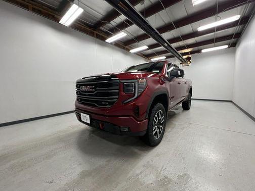 Volcanic Red Tintcoat 2026 GMC Sierra 1500 AT4