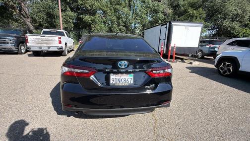 Midnight Black Metallic 2023 Toyota Camry Hybrid LE