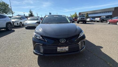 Midnight Black Metallic 2023 Toyota Camry Hybrid LE