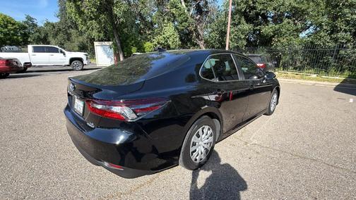 Midnight Black Metallic 2023 Toyota Camry Hybrid LE