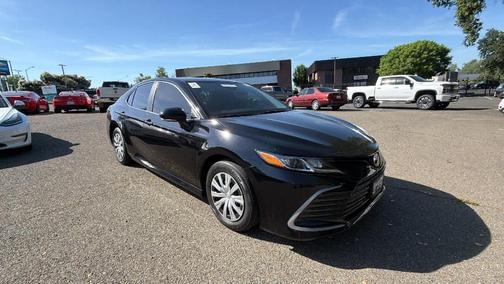 Midnight Black Metallic 2023 Toyota Camry Hybrid LE