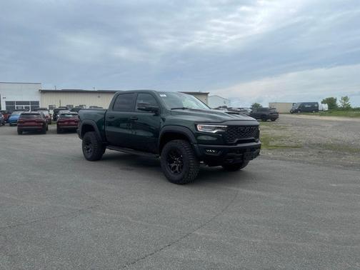 Serrano Green Metallic 2026 RAM 1500 RHO Crew Cab 4x4 5'7' Box