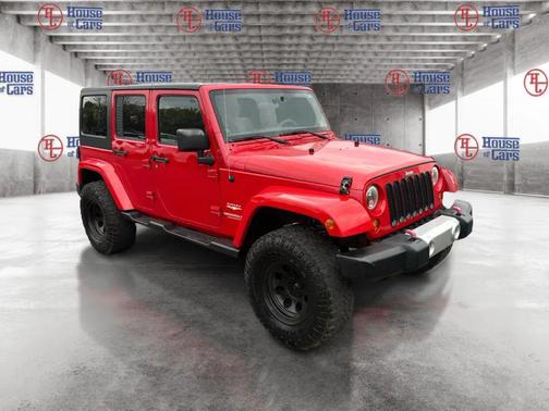 Red 2012 Jeep Wrangler Unlimited Sahara