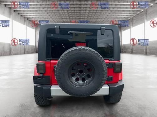 Red 2012 Jeep Wrangler Unlimited Sahara