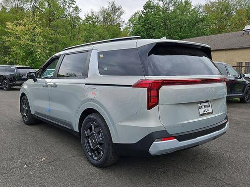 Ivory Silver 2026 Kia Carnival Hybrid EX
