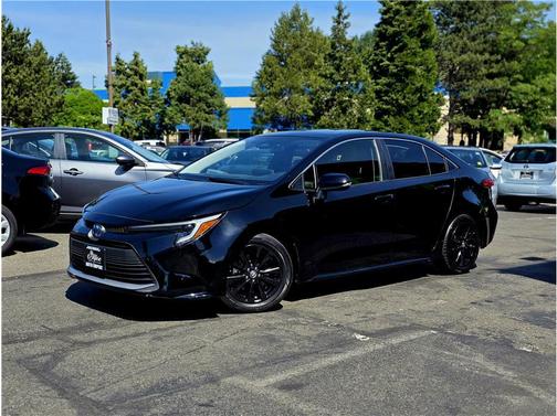 Midnight Black Metallic 2024 Toyota Corolla Hybrid SE