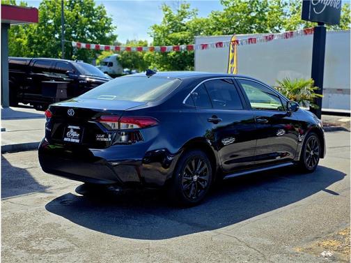 Midnight Black Metallic 2024 Toyota Corolla Hybrid SE