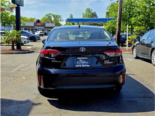 Midnight Black Metallic 2024 Toyota Corolla Hybrid SE