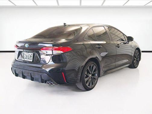 Midnight Black Metallic 2025 Toyota Corolla Hybrid SE