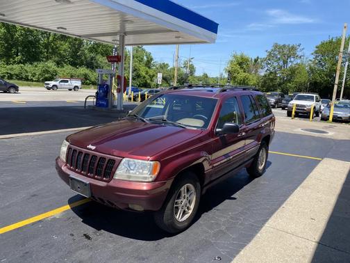 Red 1999 Jeep Grand Cherokee Limited 4WD