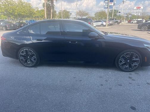 Carbon Black Metallic 2025 BMW 540 i xDrive