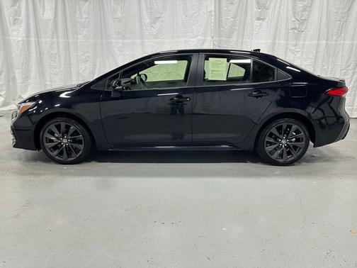 Midnight Black Metallic 2025 Toyota Corolla Hybrid SE