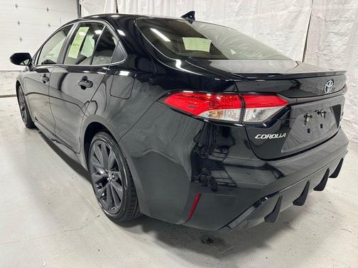 Midnight Black Metallic 2025 Toyota Corolla Hybrid SE