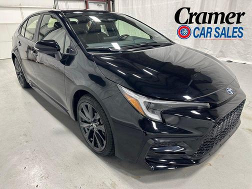 Midnight Black Metallic 2025 Toyota Corolla Hybrid SE