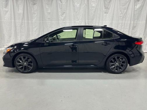 Midnight Black Metallic 2025 Toyota Corolla Hybrid SE