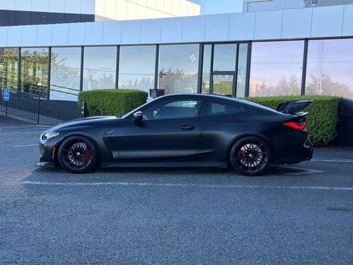Black Sapphire Metallic 2024 BMW M4 Competition xDrive