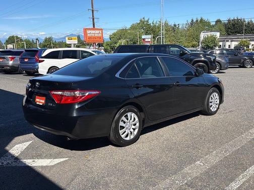 Midnight Black Metallic 2016 Toyota Camry Hybrid LE
