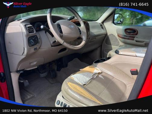 Red 2002 Ford F-150 King Ranch SuperCrew