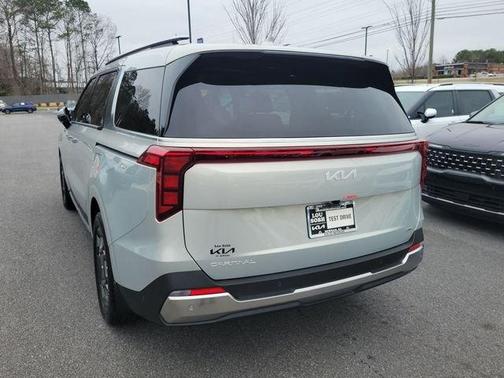 Ivory Silver 2026 Kia Carnival Hybrid SX