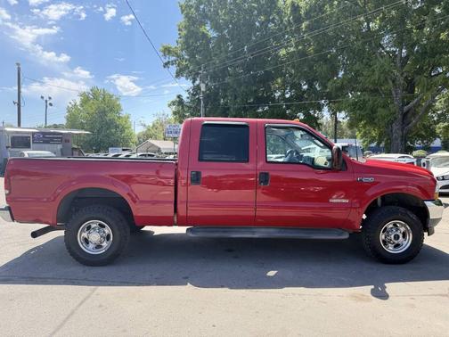 Red 2003 Ford F-250 Lariat