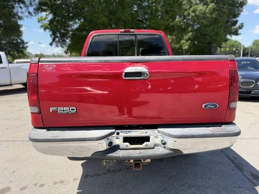 Red 2003 Ford F-250 Lariat