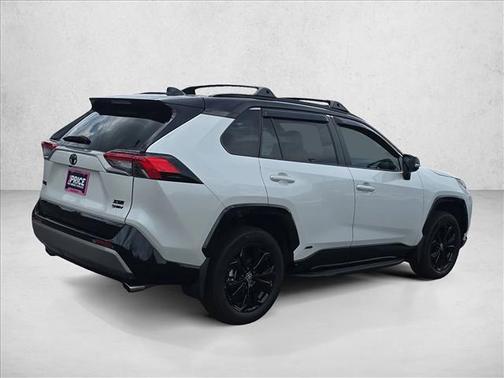 Wind Chill Pearl/Midnight Black Metallic 2025 Toyota RAV4 Hybrid SE