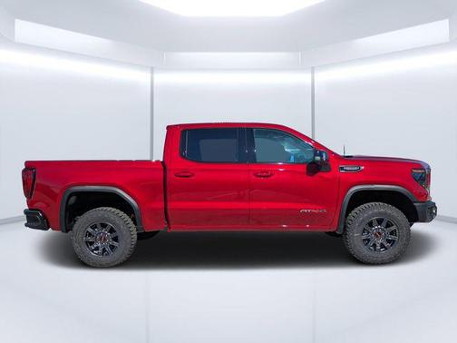 Volcanic Red Tintcoat 2026 GMC Sierra 1500 AT4X