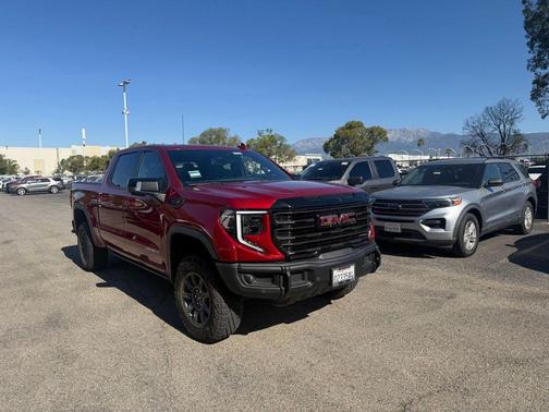 Volcanic Red Tintcoat 2024 GMC Sierra 1500 AT4X