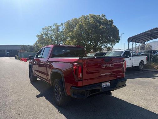 Volcanic Red Tintcoat 2024 GMC Sierra 1500 AT4X