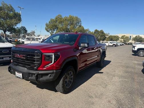 Volcanic Red Tintcoat 2024 GMC Sierra 1500 AT4X